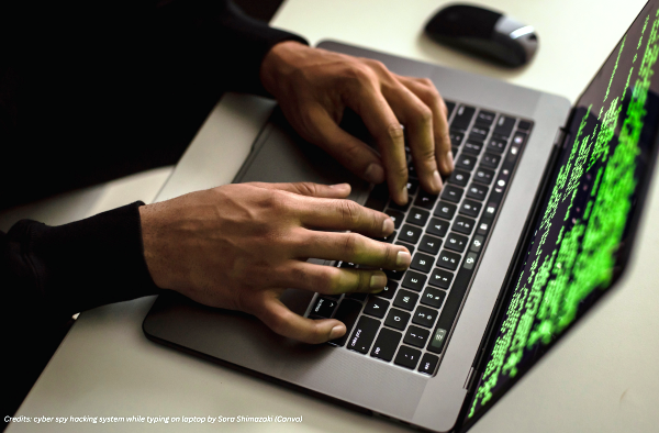 cyber spy hacking system while typing on laptop by Sora Shimazaki