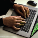 cyber spy hacking system while typing on laptop by Sora Shimazaki